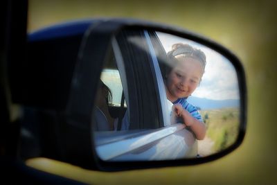 Reflection of people in train