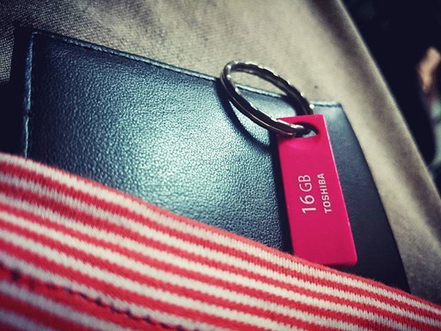 red, indoors, close-up, still life, pink color, no people, metal, single object, table, high angle view, communication, man made object, technology, connection, simplicity, plastic, variation, absence, equipment, detail