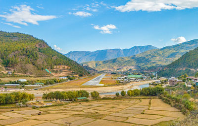 Scenic view of landscape and mountains against sky