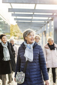 Senior women walking at station