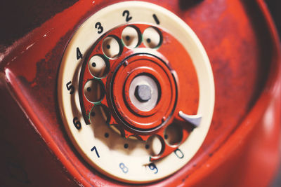 Close-up of red rotary phone