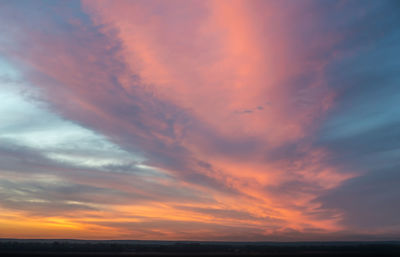 Low angle view of dramatic sky during sunset