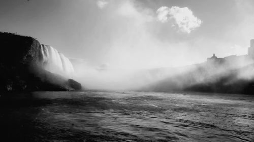 Scenic view of niagra falls against sky