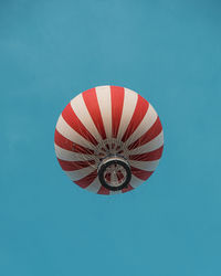 Low angle view of hot air balloon against clear blue sky