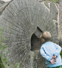 High angle view of boy standing outdoors