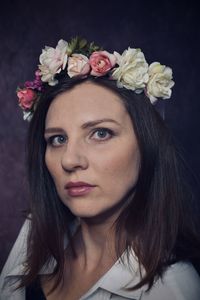 Portrait of young woman with roses