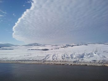 Scenic view of snowcapped mountains against sky