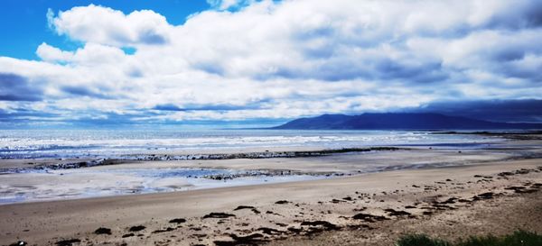 Scenic view of beach against sky christopher downey belfast