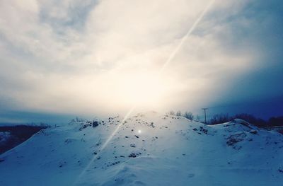 Scenic view of snow covered mountain against sky