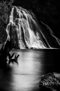 Scenic view of waterfall in forest