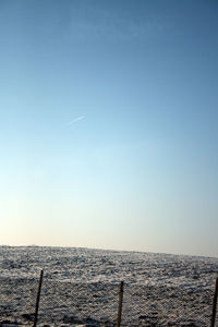 Scenic view of beach against clear sky