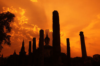 Low angle view of silhouette temple against sky during sunset