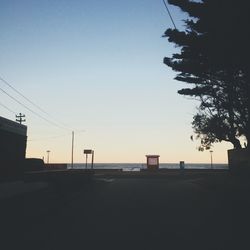 View of power lines against clear sky