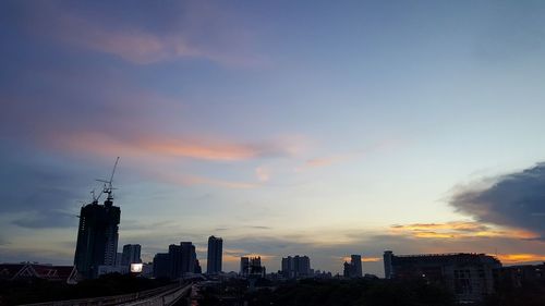 Silhouette of city at sunset