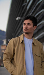 Young man looking away outdoors