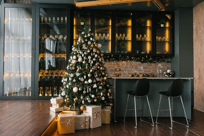 Christmas festive interior of the kitchen and dining room decorated for the new year's holiday 