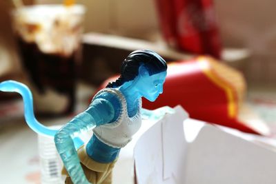 Close-up of figurine on table at home