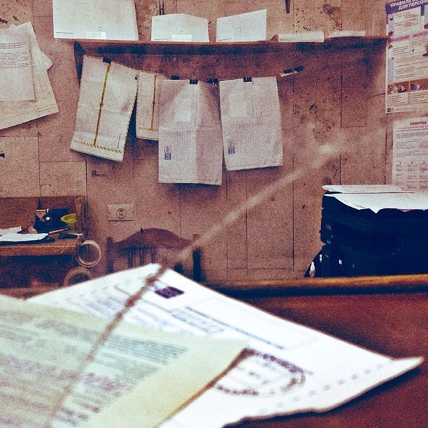 indoors, still life, table, book, close-up, paper, text, wood - material, no people, high angle view, old, education, communication, variation, day, chair, absence, selective focus, stack, wall - building feature