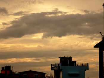 High section of building against cloudy sky