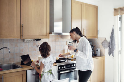 Mother and daughter in kitchen