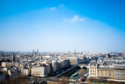 Mid distance view of eiffel tower in city against sky