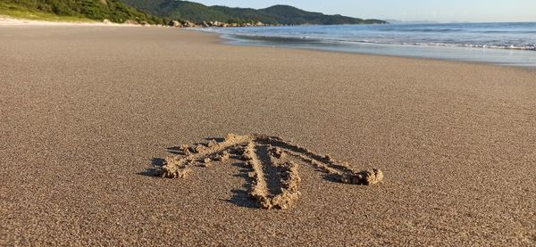 High angle view of text on beach