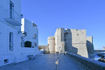 Low angle view of historic building against clear blue sky