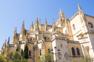 Low angle view of buildings against blue sky