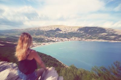 Rear view of woman looking at mountains