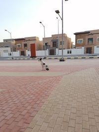 View of street amidst buildings in city