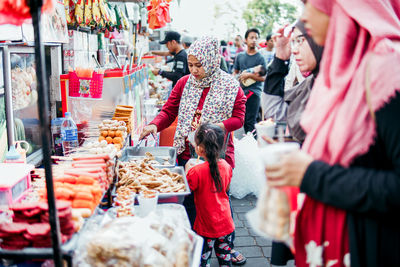 People at market stall