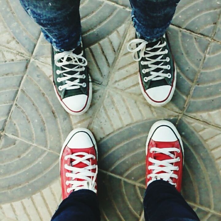 shoe, low section, human leg, standing, human body part, canvas shoe, personal perspective, high angle view, pattern, pair, real people, outdoors, two people, day, adults only, people, adult