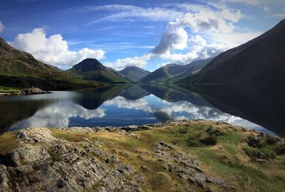 Scenic view of lake and mountains against sky