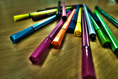 Close-up of multi colored pencils on table