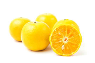 Close-up of oranges against white background