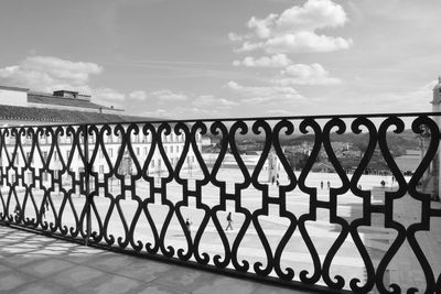 Metal fence against sky