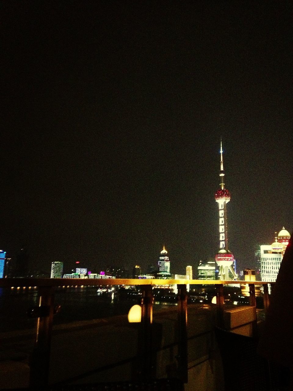 illuminated, night, built structure, architecture, building exterior, tower, travel destinations, tall - high, famous place, communication, city, clear sky, international landmark, copy space, communications tower, tourism, capital cities, travel, low angle view, spire