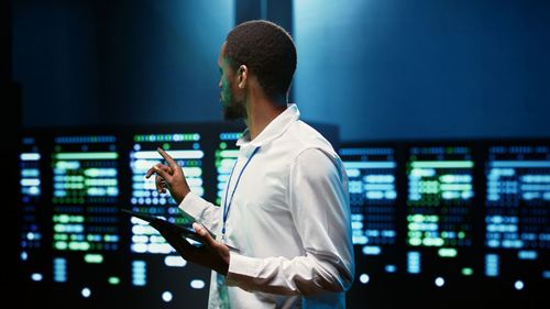 Rear view of man standing in airport