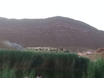 Scenic view of field against clear sky