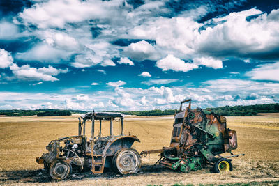 Tractor on field against sky