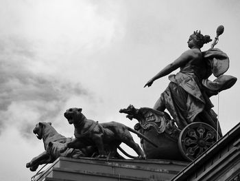 Low angle view of statue against sky