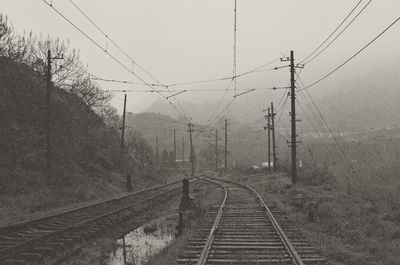 Railway tracks on snow covered landscape