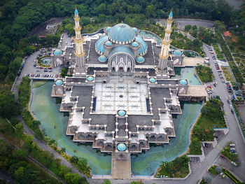 High angle view of buildings and trees in city