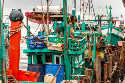 Fishing boats moored at harbor