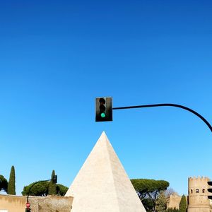 Low angle view of built structure against clear blue sky