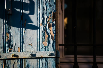 Close-up of clothes hanging on wall by building