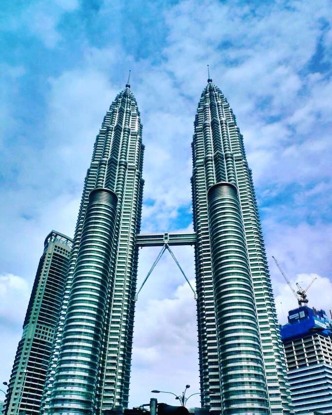 LOW ANGLE VIEW OF MODERN BUILDINGS AGAINST SKY