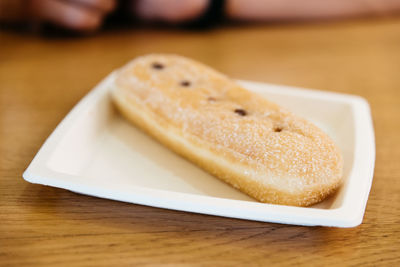 High angle view of sugar pastry served in plate on table