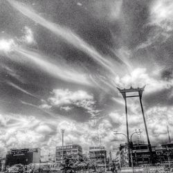 Low angle view of building against cloudy sky