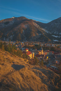 A panoramic vertical landscape view of veynes, an old town in the french alps, during the sunset